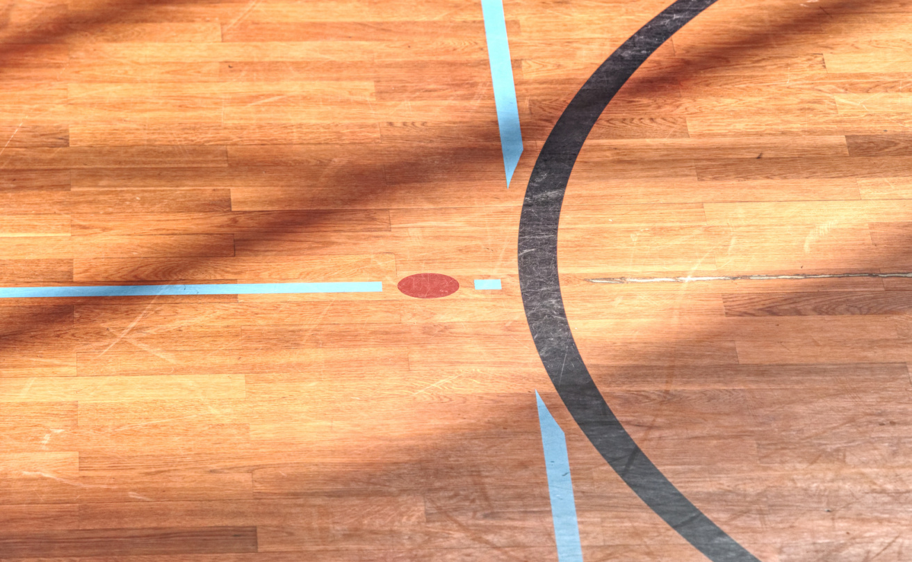 playfield-lines-painted-on-renewal-gymnasium-wooden-floor.