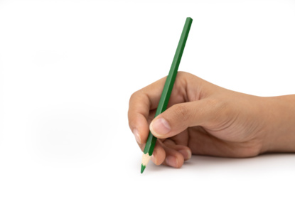mp33053928-female-hand-with-green-color-pencil-isolated-on-white