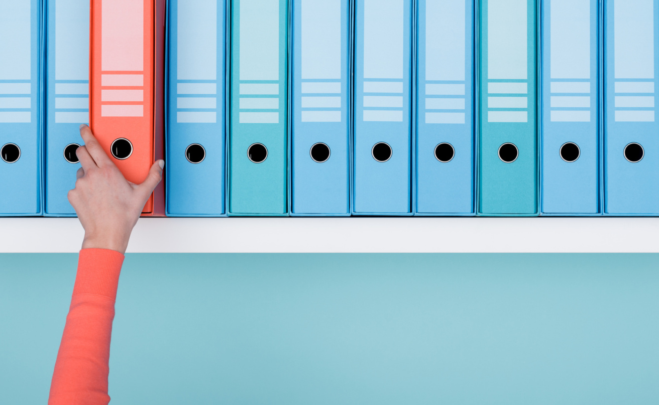 office-worker-taking-a-folder-in-the-archive