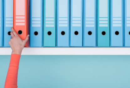 office-worker-taking-a-folder-in-the-archive