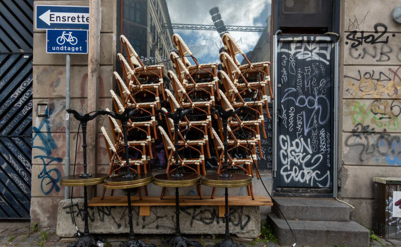 Chairs stacked outside a bar in Vesterbro